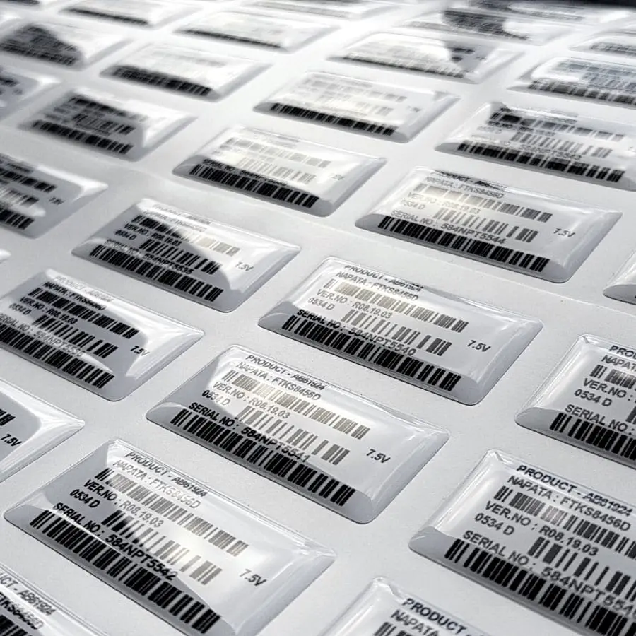 domed asset labels on a sheet